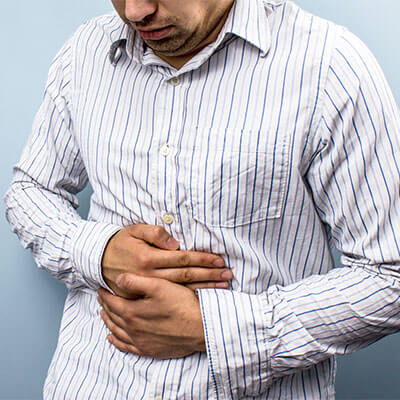 Man holding his stomach with his hands