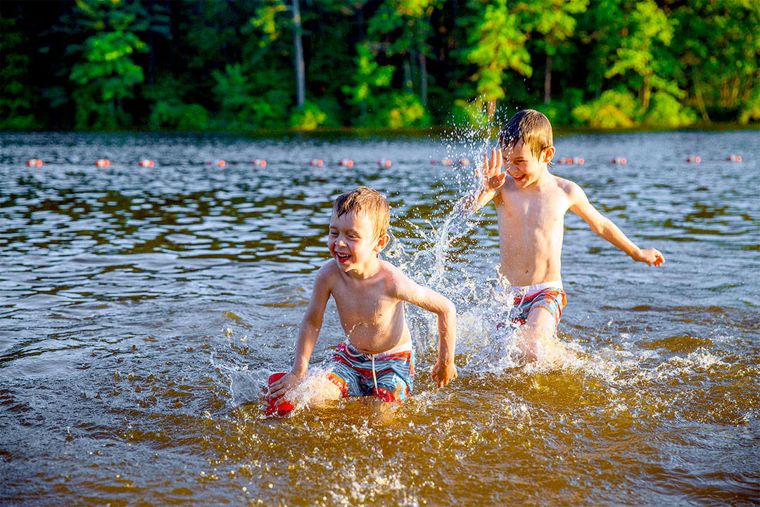2 boys playing in the water