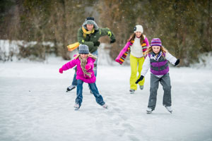 children skating in snow