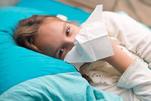 sick child with tissue
