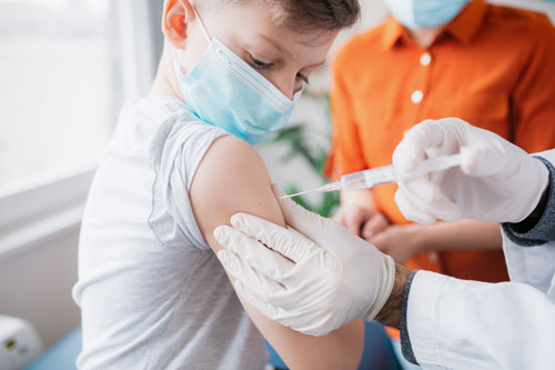 Young boy getting vaccinated