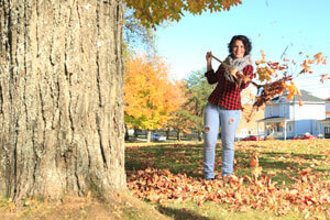 woman raking leaves